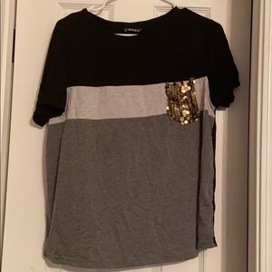 Black, white, and grey tee with sequin pocket